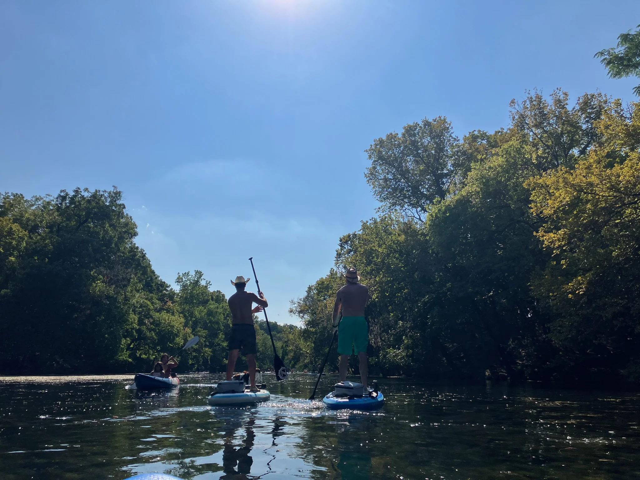 Friends paddle boarding in Austin